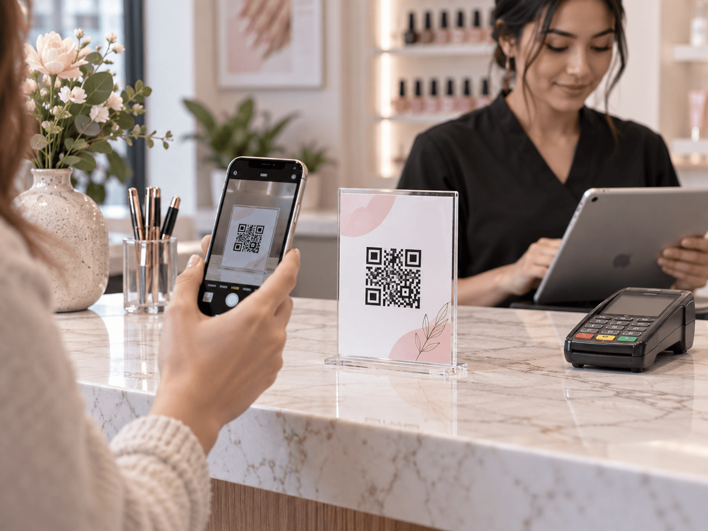 A guest scanning a printed Waitwell QR stand at the salon counter